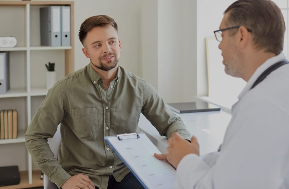 Man with a nurse clinic staff during medical detox