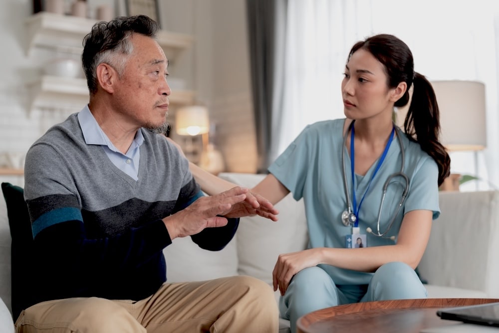 Person talking to staff during detox
