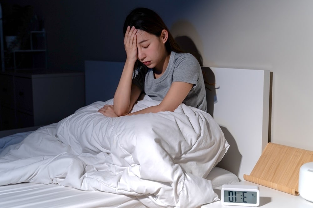 Woman struggling with common detox symptoms